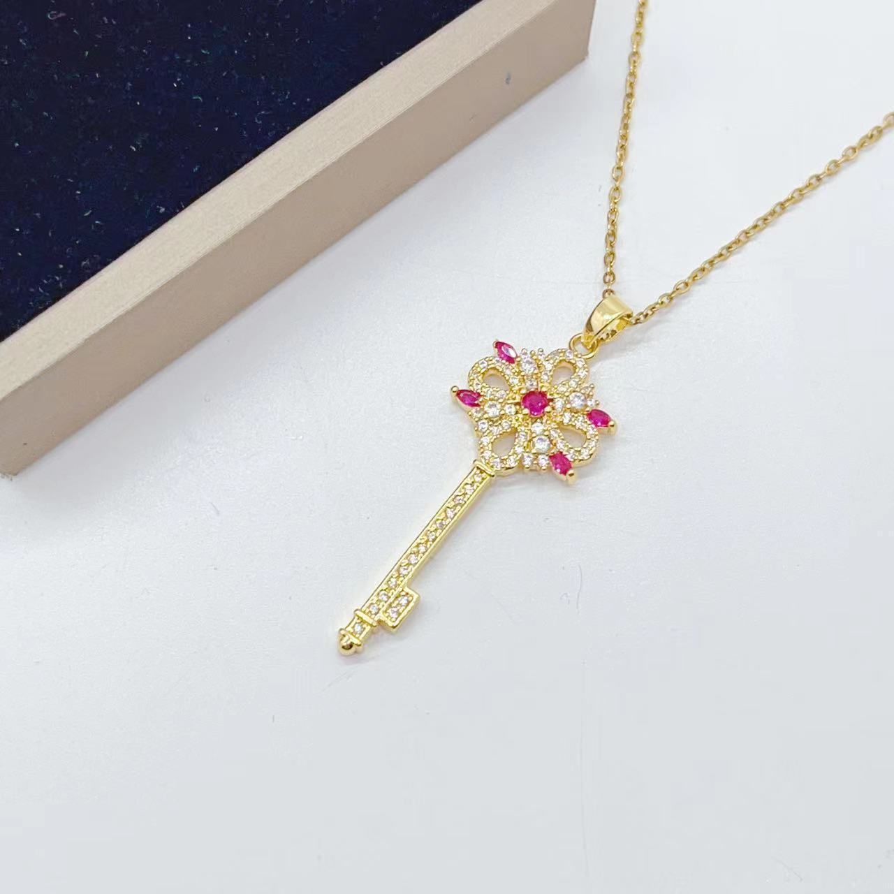 Golden Key to Elegance: Copper-Plated Zircon Pendant Necklace - Brillare Bijou