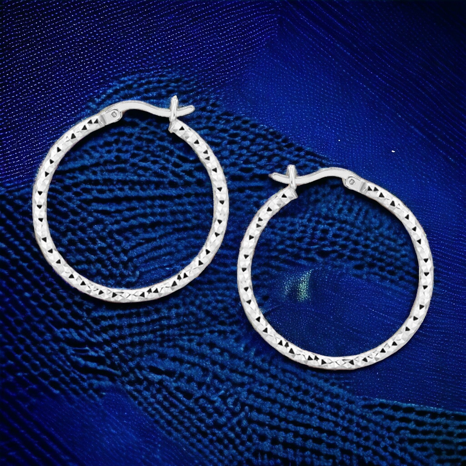 Weave Magic With Silver By Having Beautiful Jewelry That Matches Everything In Your Wardrobe, 925 Sterling Silver Faceted Motif Hoop Earrings with Rhodium Plating. - Brillare Bijou