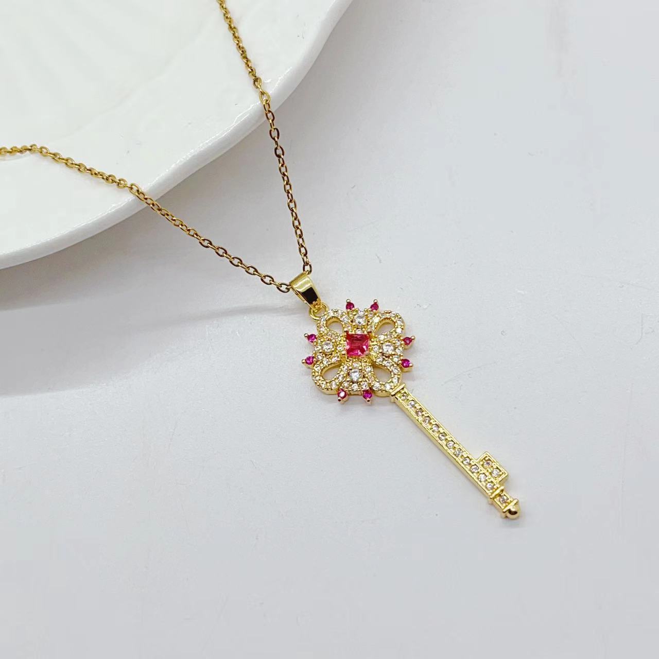 Golden Key to Elegance: Copper-Plated Zircon Pendant Necklace - Brillare Bijou