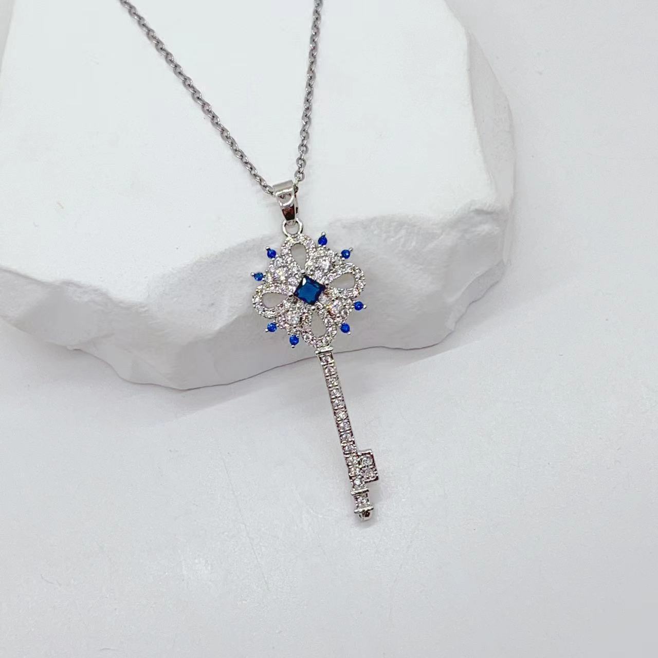 Golden Key to Elegance: Copper-Plated Zircon Pendant Necklace - Brillare Bijou