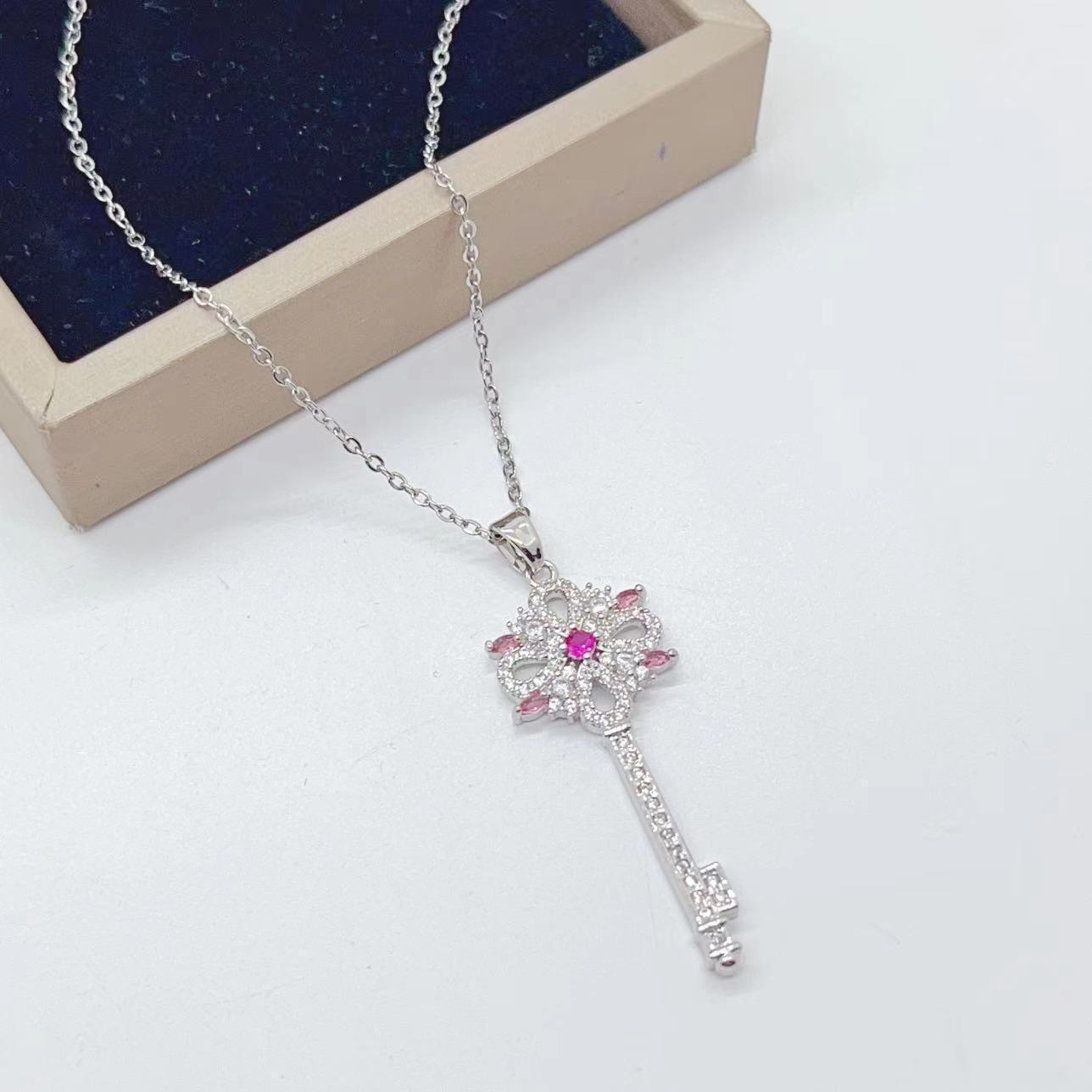 Golden Key to Elegance: Copper-Plated Zircon Pendant Necklace - Brillare Bijou